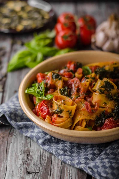 stock image Tomato pasta basil on wood vintage board, fresh herbs and cheese in