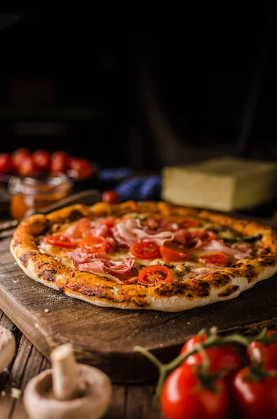 Rustic old style vintage pizza, wood board, fresh food