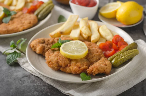 Homemade german schnitzel with pickles — Stock Photo, Image