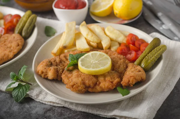 Homemade german schnitzel with pickles