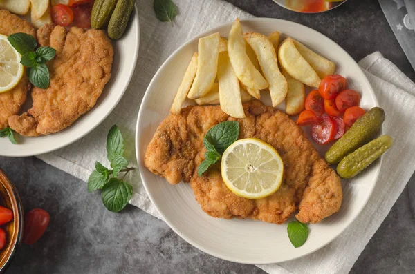 Homemade german schnitzel with pickles — Stock Photo, Image