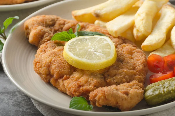 Homemade german schnitzel with pickles — Stock Photo, Image