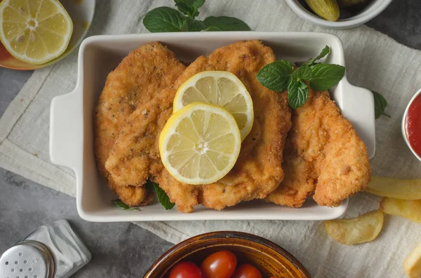 Homemade german schnitzel with pickles — Stock Photo, Image