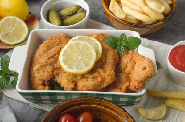 Homemade german schnitzel with pickles — Stock Photo, Image