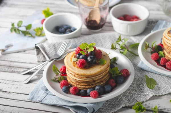 Pancakes with forest fruit sauce