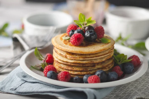 Pancakes with forest fruit sauce