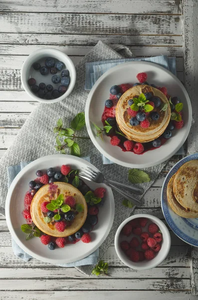 Pancakes with forest fruit sauce