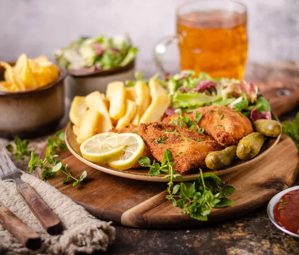 Original schnitzel with homemade french fries — Stock Photo, Image