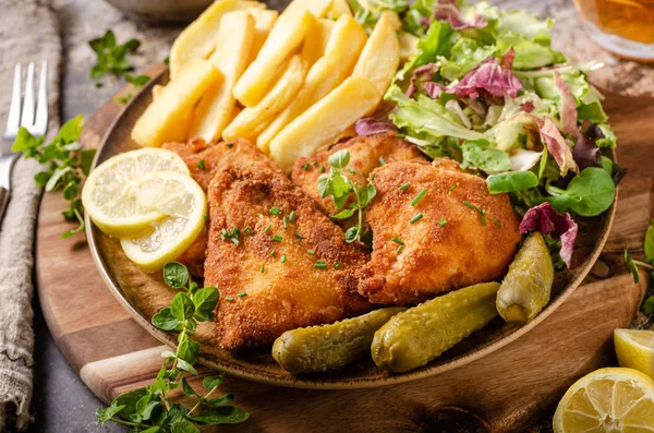 Original schnitzel with homemade french fries — Stock Photo, Image