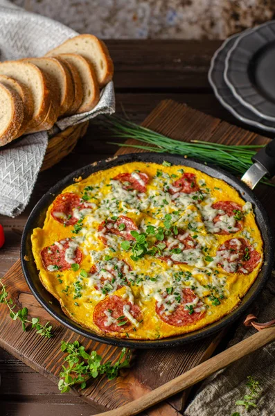 Omelette with salami and blue cheese