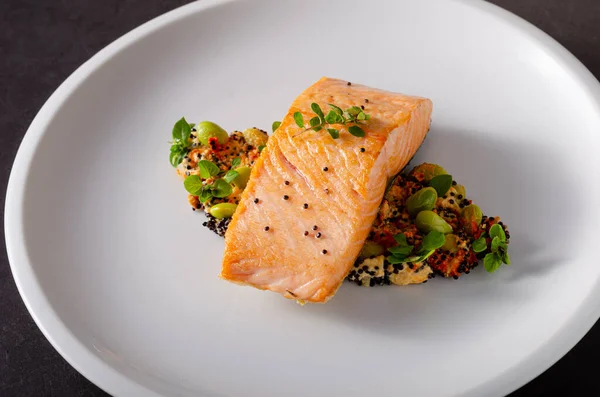 Grilled salmon with pepper hummus with quinoa — Stock Photo, Image