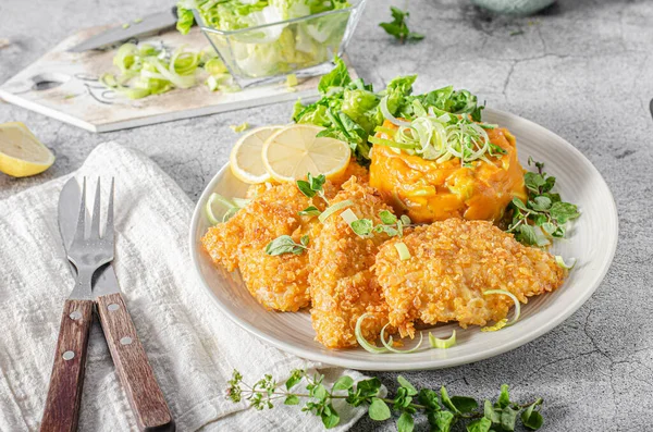 Delicious breaded meat with cornflakes and sweet potatoes