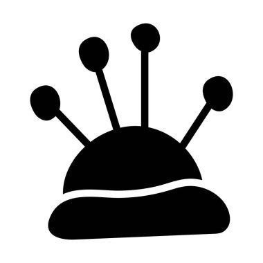 İğne desenli, küçük, doldurulmuş bir yastık.