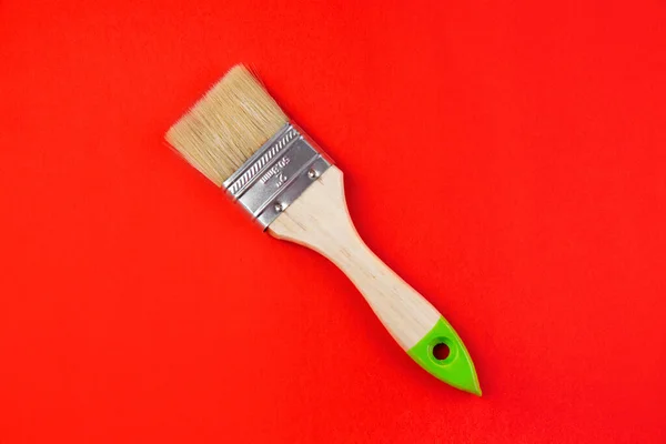 Brand new brush isolated on red background.space for text — Stock Photo, Image