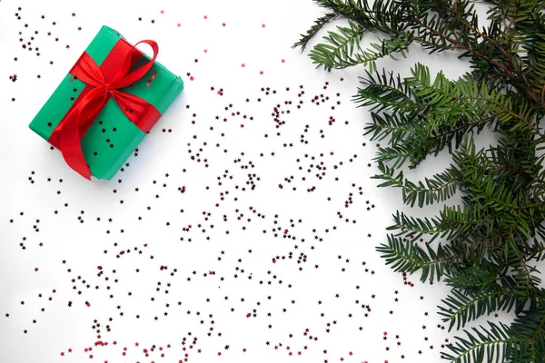 Christmas gift on the white table with Christmas tree