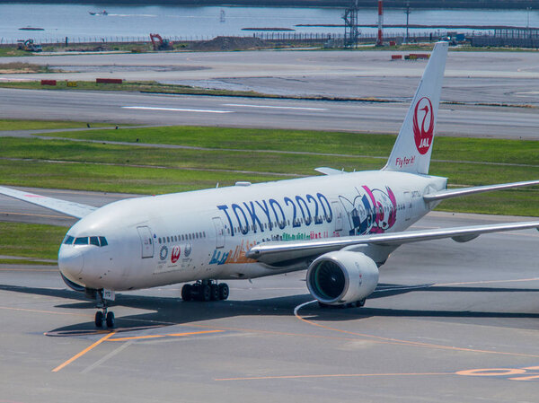 Japan Airlines (JAL) passenger plane decorated with "Tokyo 2020"