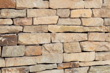Taştan yapılmış bir duvarın mimari arka planı