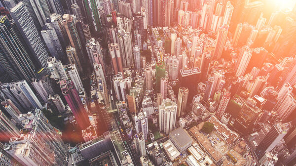 Aerial photo from flying drone of an amazing landscape on a China city with modern skyscrapers and enterprises. Top view on a developed Hong Kong town with office buildings and advanced infrastructure