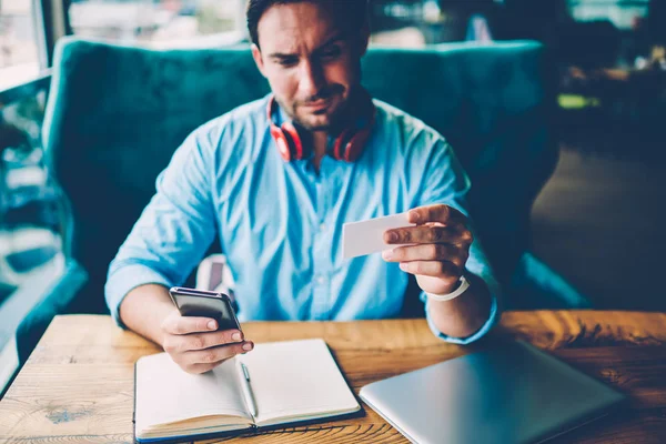 Bearded Man Modern Headphones Neck Dialing Phone Number Modern Smartphone — Stock Photo, Image