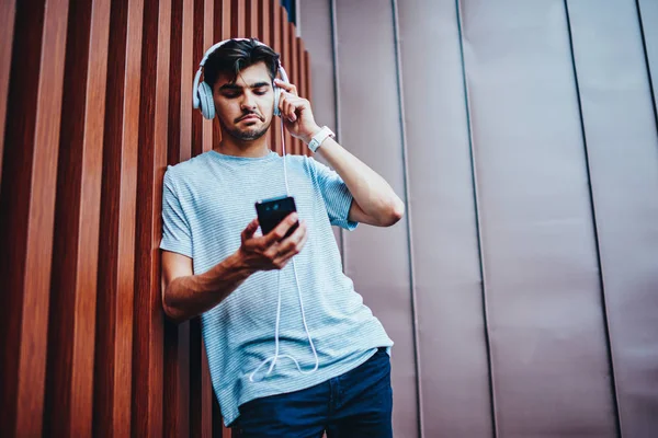 Stylish Male Blogger Listening Music Playlist Modern Headphones Connected Smartphone — Stock Photo, Image