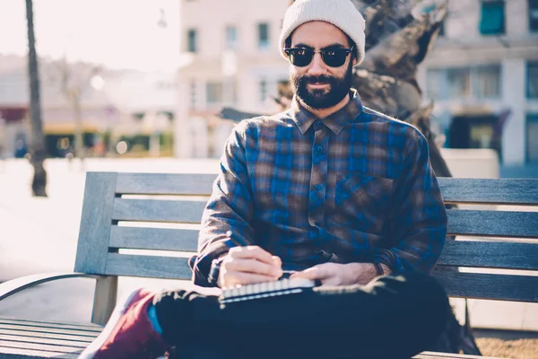 Bearded Student Sunglasses Drawing Notepad Sitting Wooden Bench Leisure Time — Stock Photo, Image