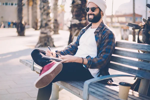 Cheerful Bearded Guy Sunglasses Sitting Bench Spending Free Time Hobby — Stock Photo, Image