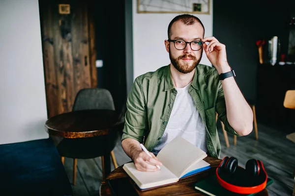 Young Hipster Male Student Eyeglasses Writing Essay Homework Bearded Man — Stock Photo, Image