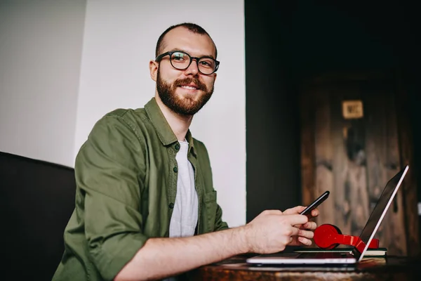 Portrait Handsome Hipster Man Distracted Work Laptop Freelancer Holding Mobile — Stock Photo, Image