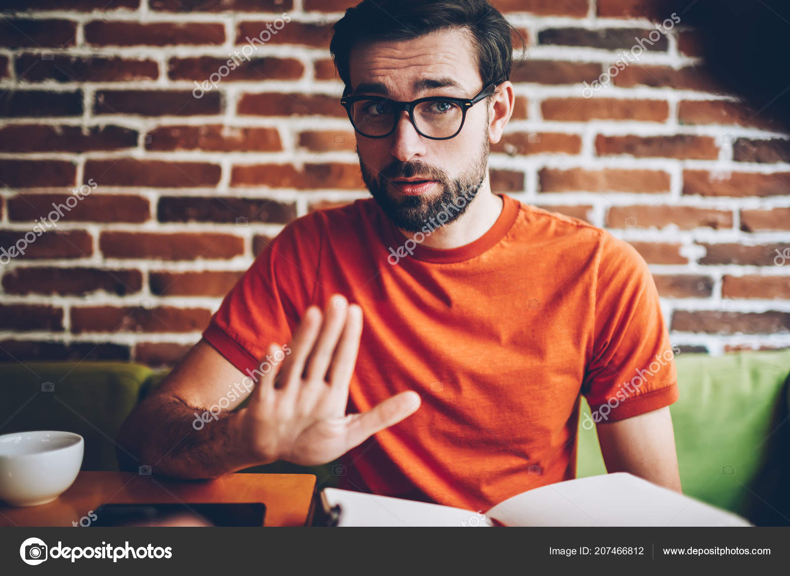 orange shirt guy