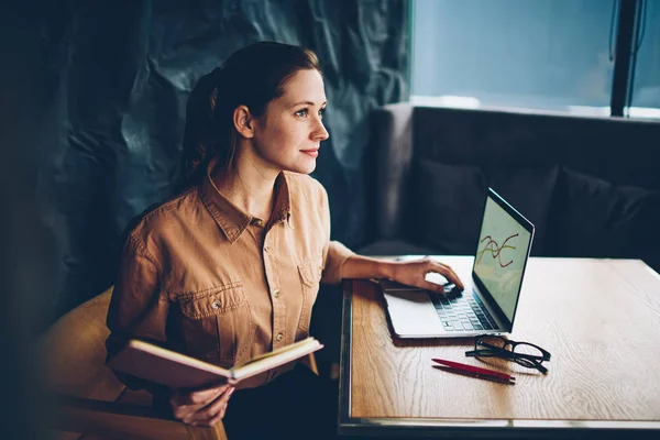 Contemplative Clever Hipster Student Studying Book Hands Sitting Laptop Device — Stock Photo, Image