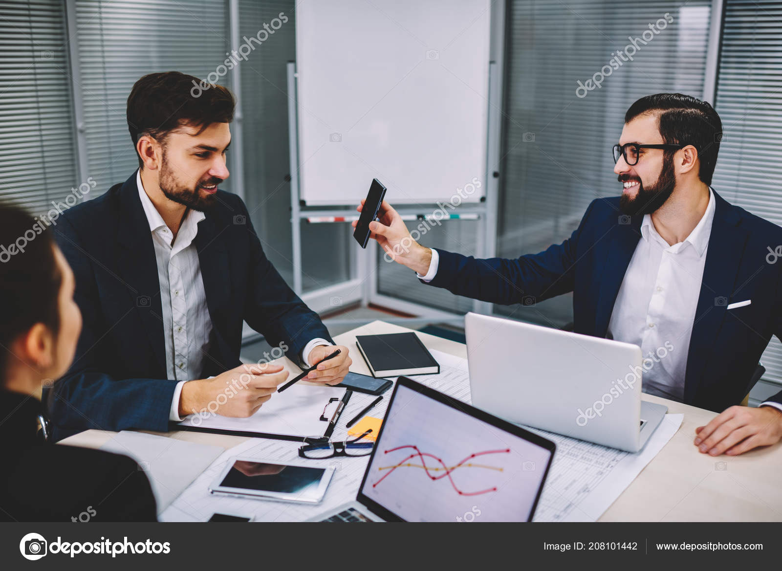 Cheerful Bearded Financial Manager Showing Smartphone Funny Business News Colleague Stock Photo by ©GaudiLab 208101442 Cheerful Bearded Financial Manager Showing Smartphone Funny Business News Colleague Stock Photo by ©GaudiLab 208101442