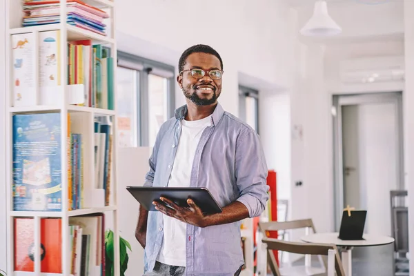 Prosperous African American Businessman Casual Wear Holding Digital Tablet Thinking — Stock Photo, Image