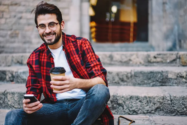 Portrait Cheerful Handsome Hipster Guy Spectacles Sitting Stairs Town Coffee — Stok Foto