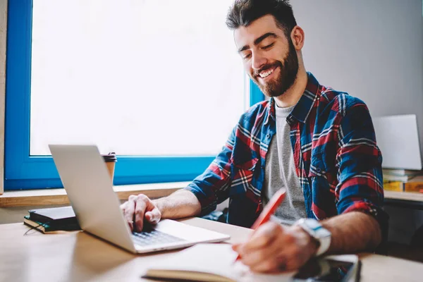 Happy Handsome Male Copywriter Working Indoors While Writing Exited Ideas — Stock Photo, Image