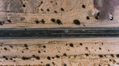 Aerial scenery view of freeway historical Route in USA, birds eye view of beautiful wild lands of desert and asphalt interstate highway with dry climate in Arizona clipart