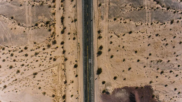 Birds eye view of famous highway in America located on west wild sandy lands, aerial view of historic Landmark Route  with old cracked asphalt in desert environment