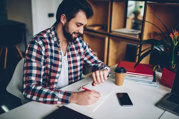 Caucasian Bearded Young Man Looking Wristwatch While Working Indoors Hipster — Stock Photo, Image