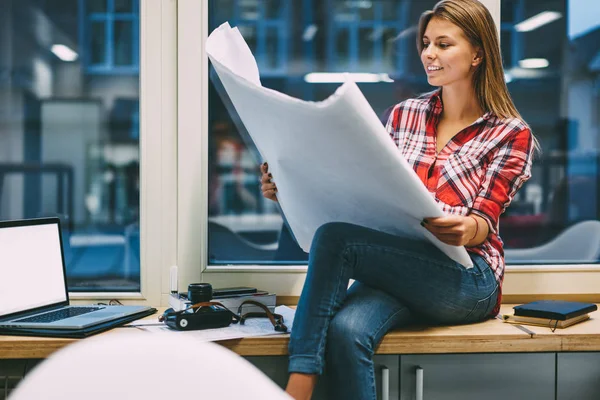 Successful Young Woman Holding Architectural Blueprint Hands Sitting Windowsill Office — Stock Photo, Image