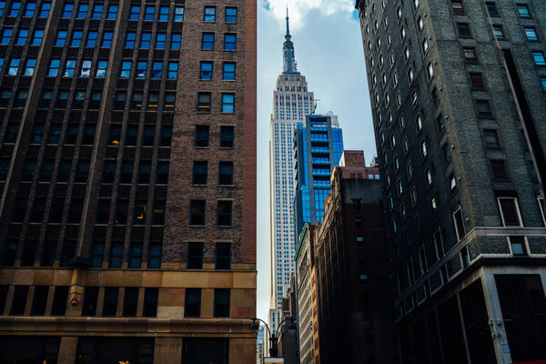 Contemporary architecture of metropolis with offices and residential apartments for rent in downtown, high skyscraper with corporate headquarters located near buildings with flats in distric