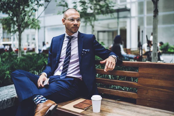 Pondering Confident Businessman Dressed Stylish Elegant Suit Sitting Wooden Bench — Stock Photo, Image