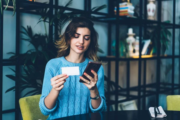 Attractive Hipster Girl Sitting Table Holding Business Card Dialing Number — Stock Photo, Image