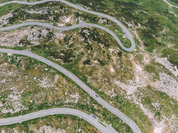 Bird\'s eye view of serpentine curves. Top aerial view of scenic route in Austria with name Grossglockner High Alpine Road. Some of hairpin turns of Hochtor Pass