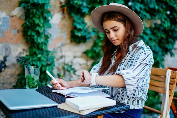 Pensive Female Blogger Writing Notebook Checking Notification Modern Designed Wearable — Stock fotografie