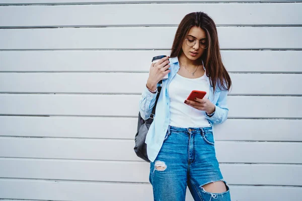 Young Woman Black Backpack Holding Red Smartphone Checking Email Device — Stock Photo, Image