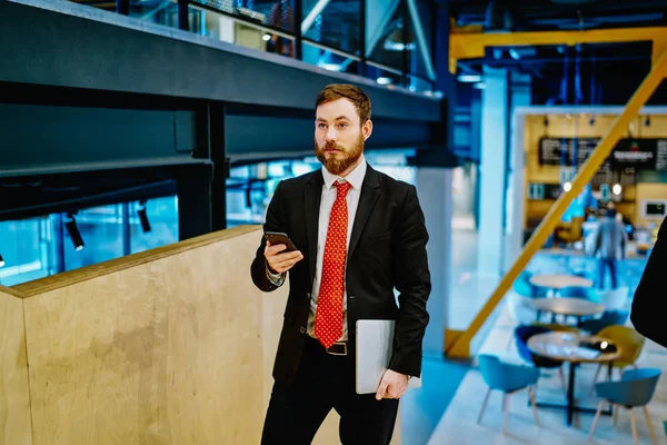Thoughtful Businessman Stylish Suit Holding Netbook Modern Smartphone Device While — Stock Photo, Image