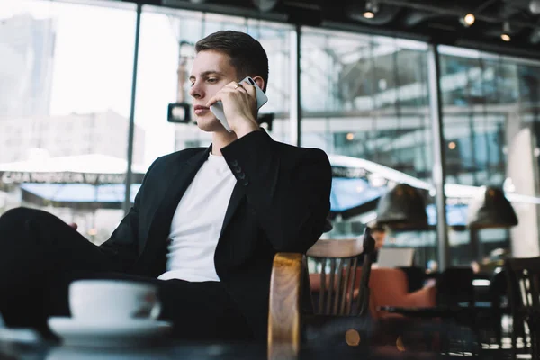 Concentrated Young Male Employee Wearing Formal Suit Talking Mobile Phone — Stock Photo, Image