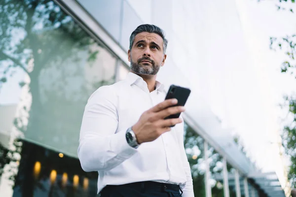Contemplative Caucasian Male Entrepreneur Thoughtful Looking Away While Sending Text — Stock Photo, Image