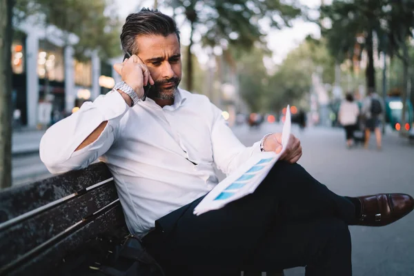 Middle Aged Professional Expert Calling Colleague Consultancy While Analyzing Paperwork — Stock Photo, Image