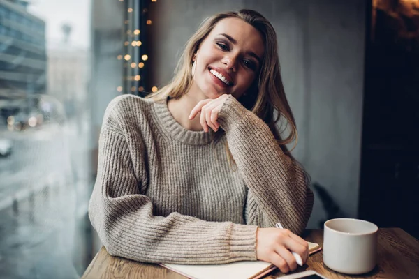 Smiling Young Female Casual Wear Sitting Window Taking Notes While — Stock Photo, Image