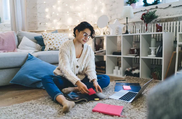 Full Body Concentrated Female Casual Sweater Eyeglasses Sitting Floor Taking — Stock Photo, Image